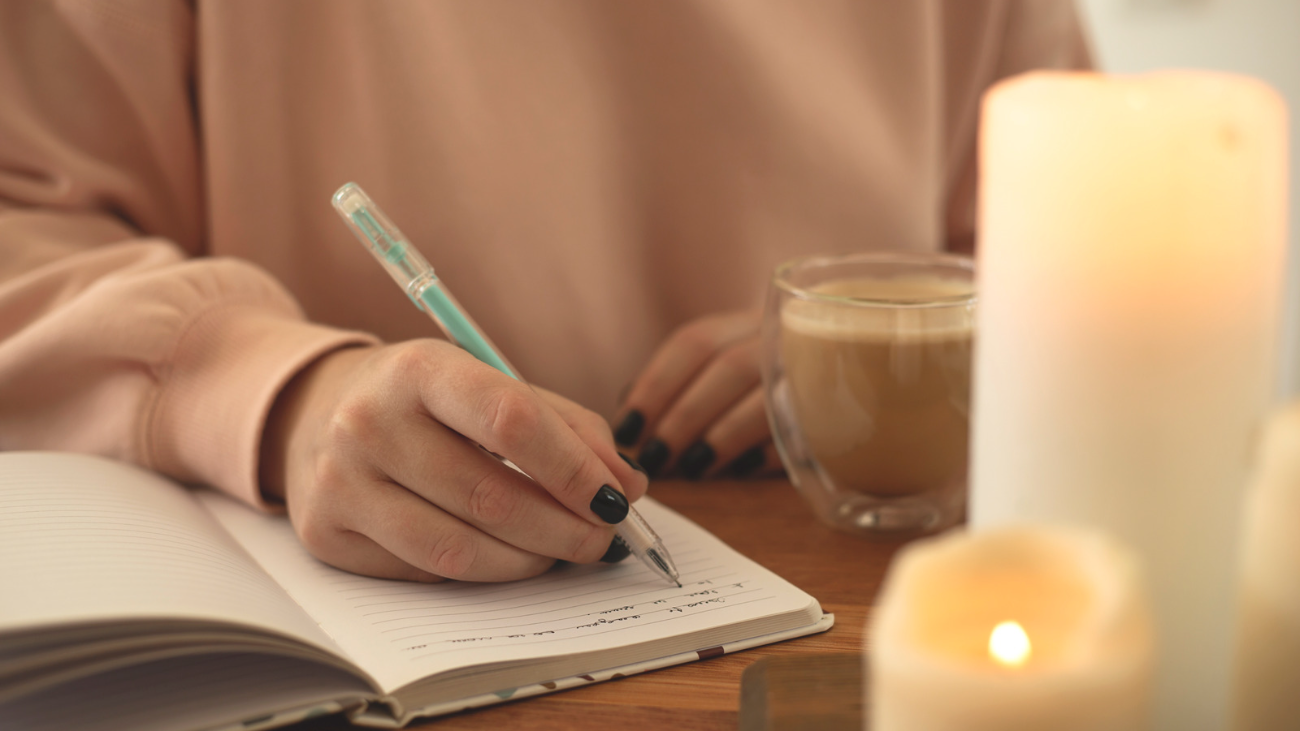 a woman journalling to de-stress