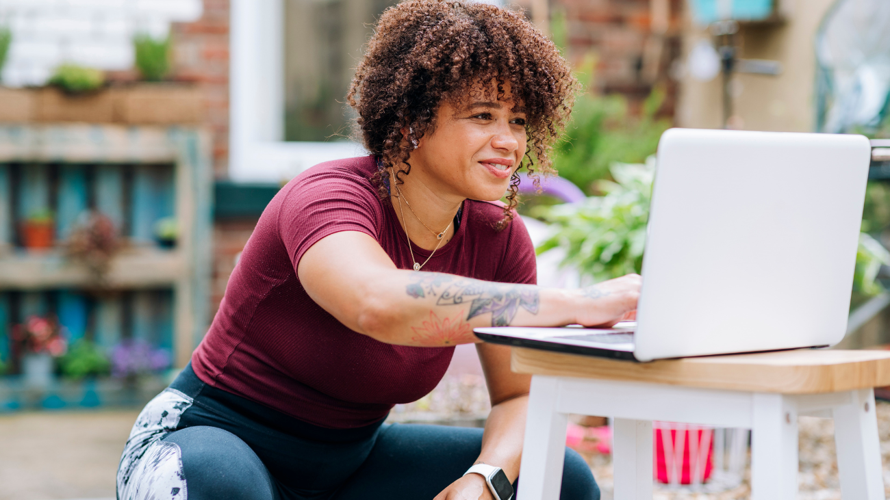 yoga teacher on laptop